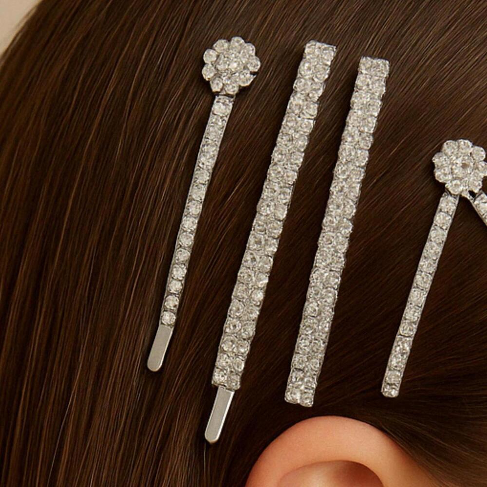 Brand New 4-piece bobby pins with silver gems and floral designs.